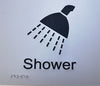 TP SIGH-SHOWER Braille Sign